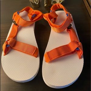 Men’s Tevas orange and white sandals